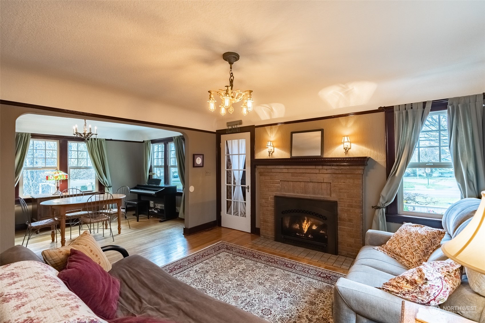 2212 Broadway Bellingham, WA 98225 - Photo 4 of 40 a living room with furniture a window and a fireplace