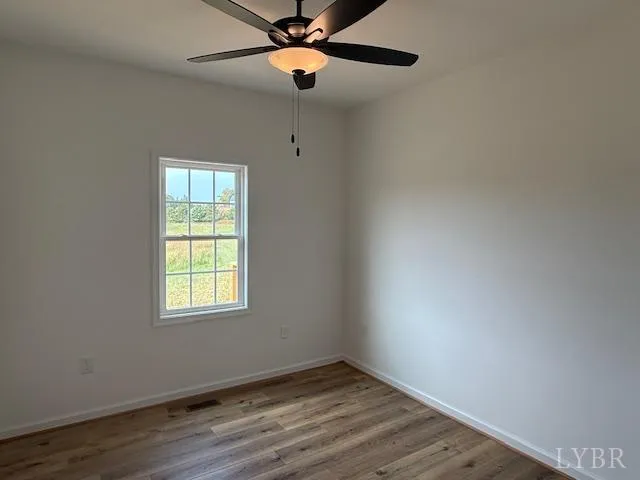 a bathroom with a toilet and a bath tub