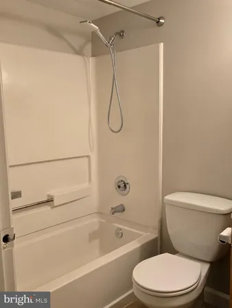 a bathroom with a toilet and a sink