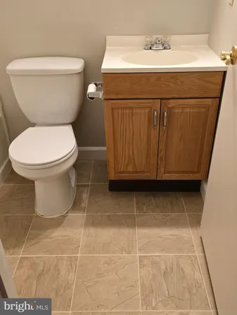 a view of kitchen island wooden floor and a sink
