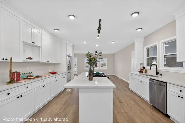 an empty room with a window and a ceiling fan