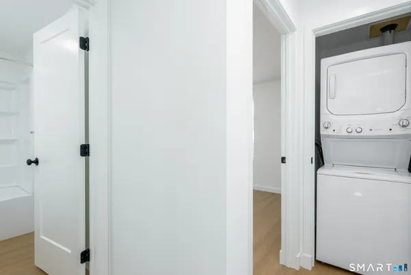 a bathroom with a toilet and a mirror