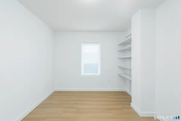 a view of a room that has a window in it