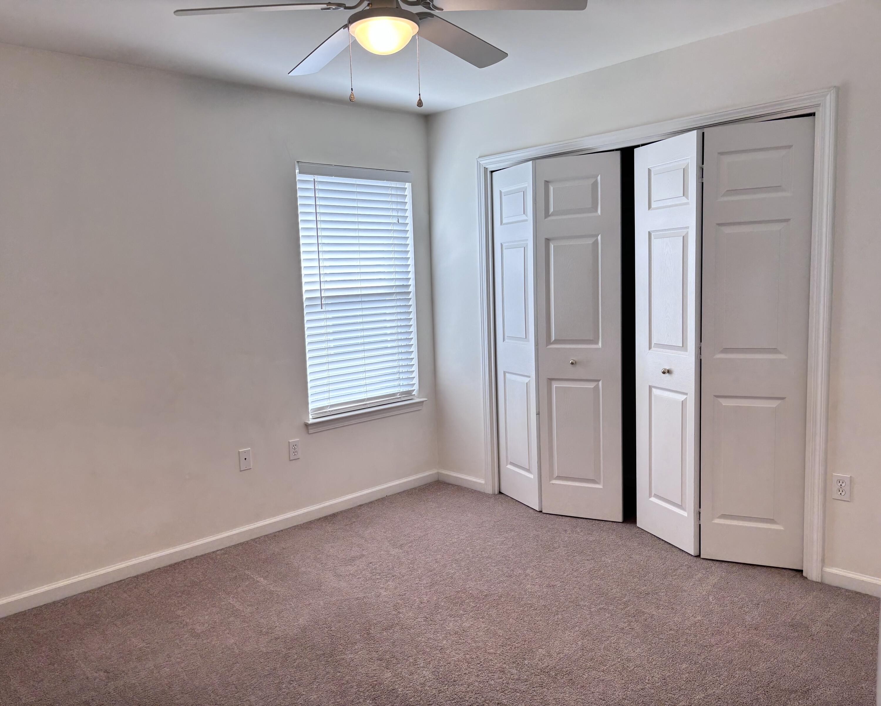 64 7th Street Shalimar, FL 32579 - Photo 12 of 16 an empty room with windows and closet