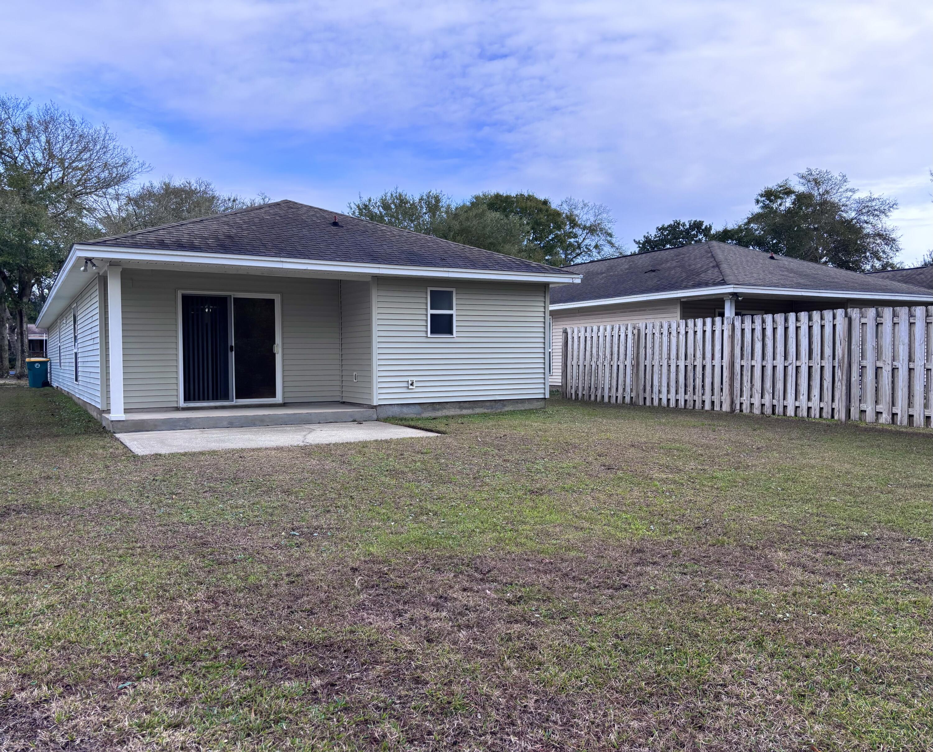 64 7th Street Shalimar, FL 32579 - Photo 15 of 16 a view of a house with a yard