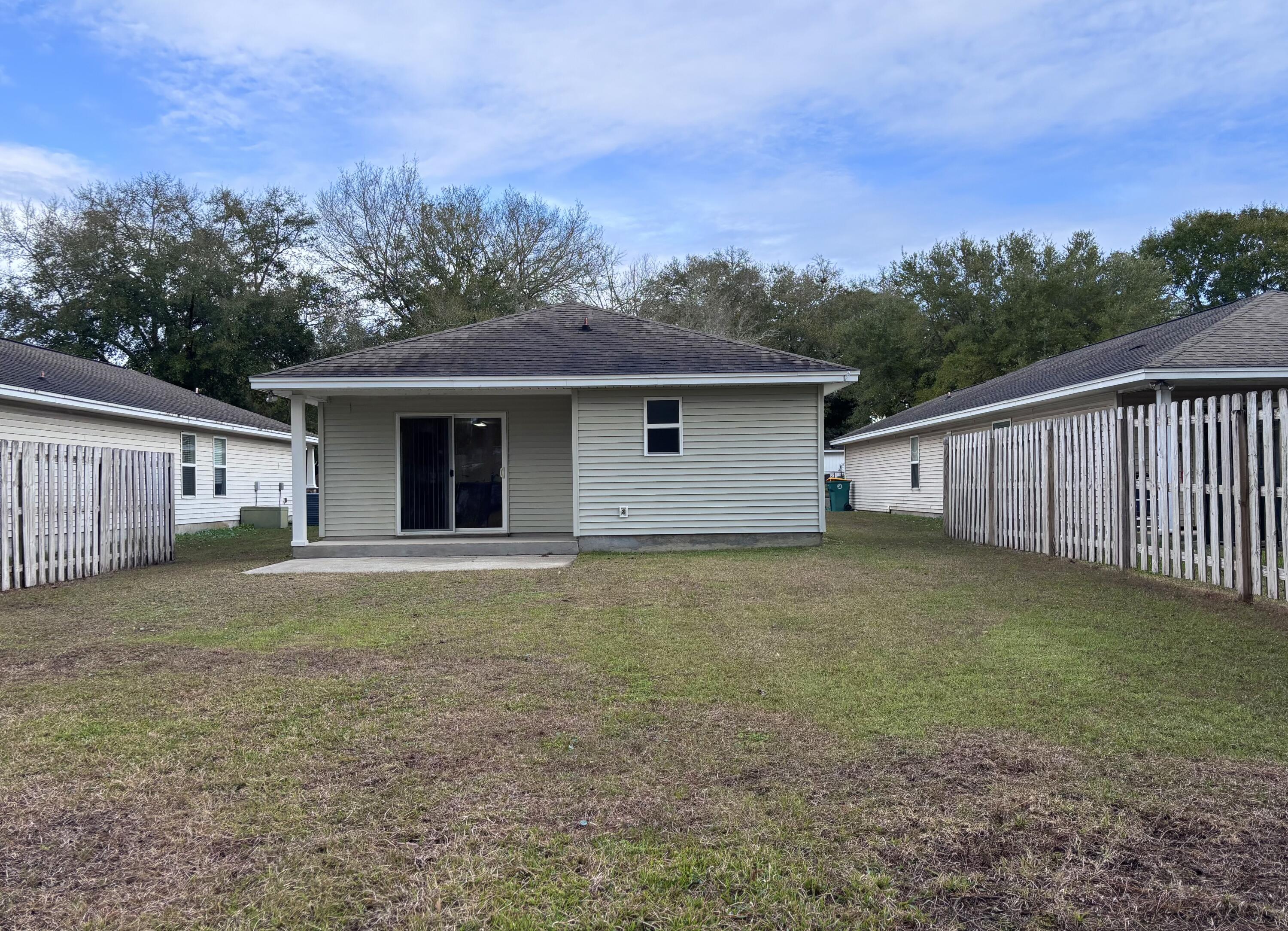 64 7th Street Shalimar, FL 32579 - Photo 16 of 16 a front view of house with yard and trees