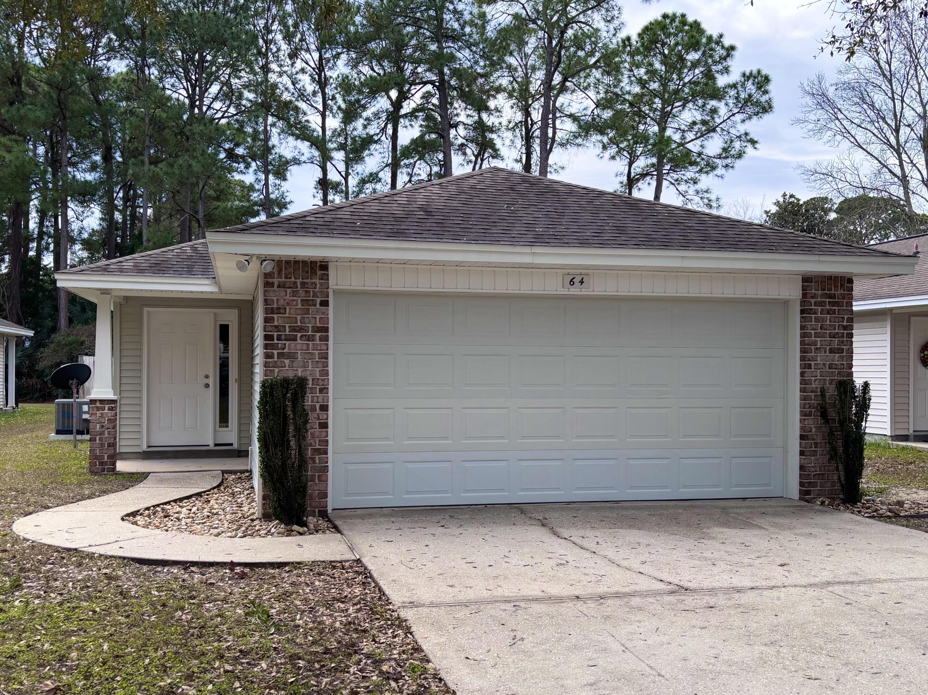 64 7th Street Shalimar, FL 32579 - Photo 2 of 16 a front view of a house