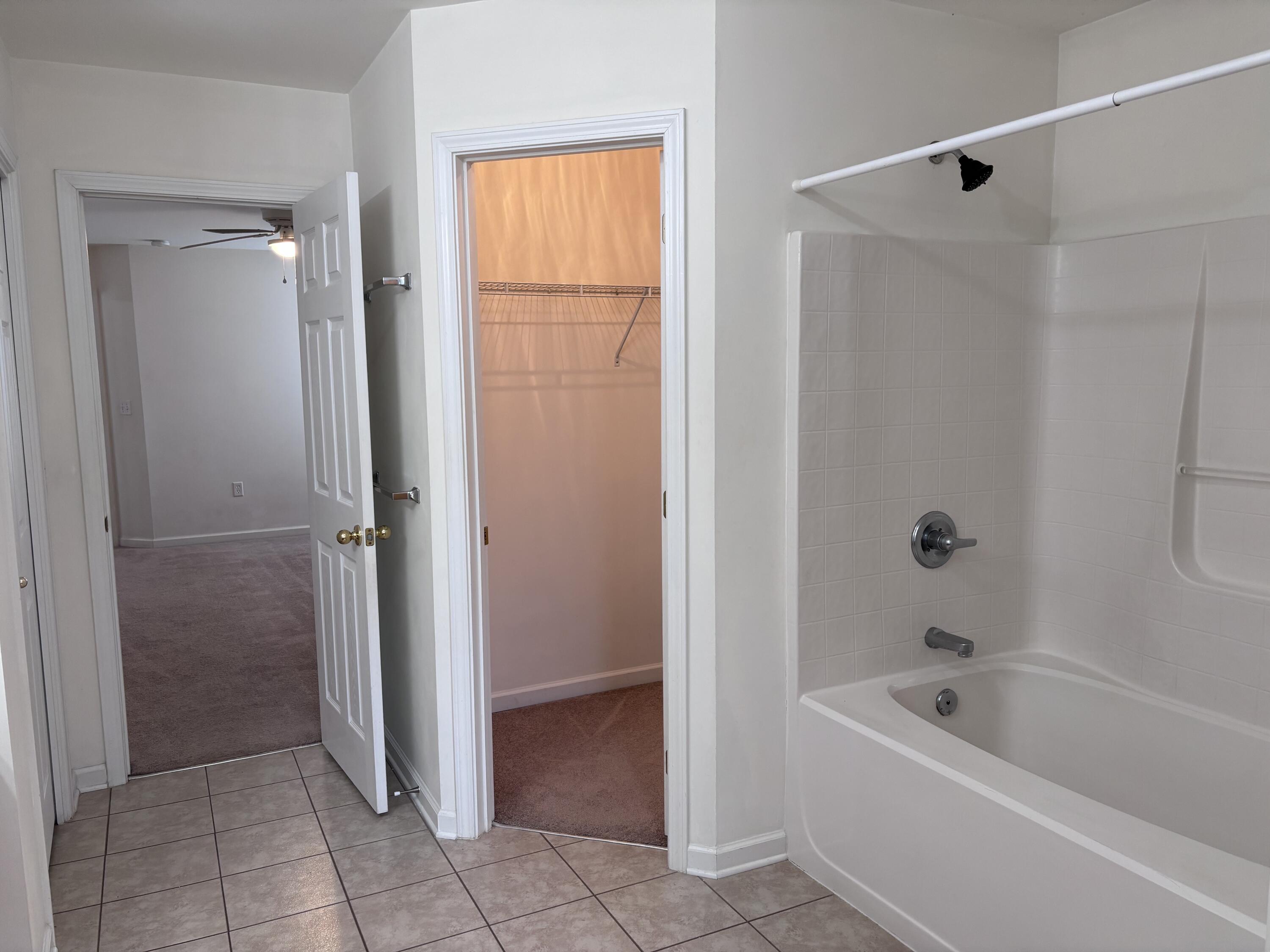 64 7th Street Shalimar, FL 32579 - Photo 9 of 16 a bathroom with a tub shower and a sink