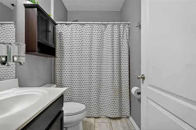 a bathroom with a toilet and a sink