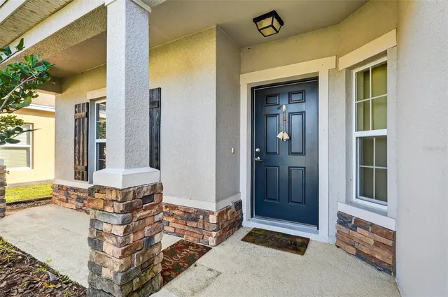 a view of an entryway with a front door