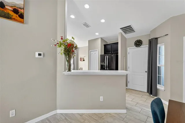 a view of living room with furniture and flowers