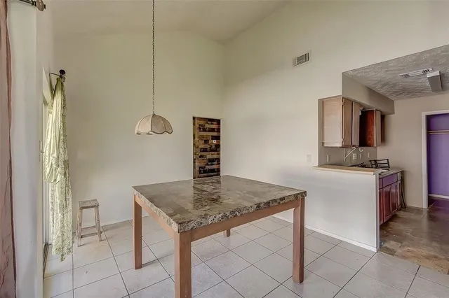 a kitchen with a sink a counter top space and cabinets