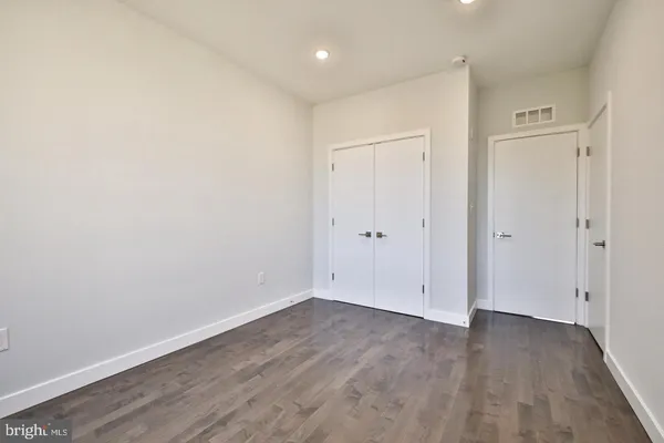 a view of room with wooden floor