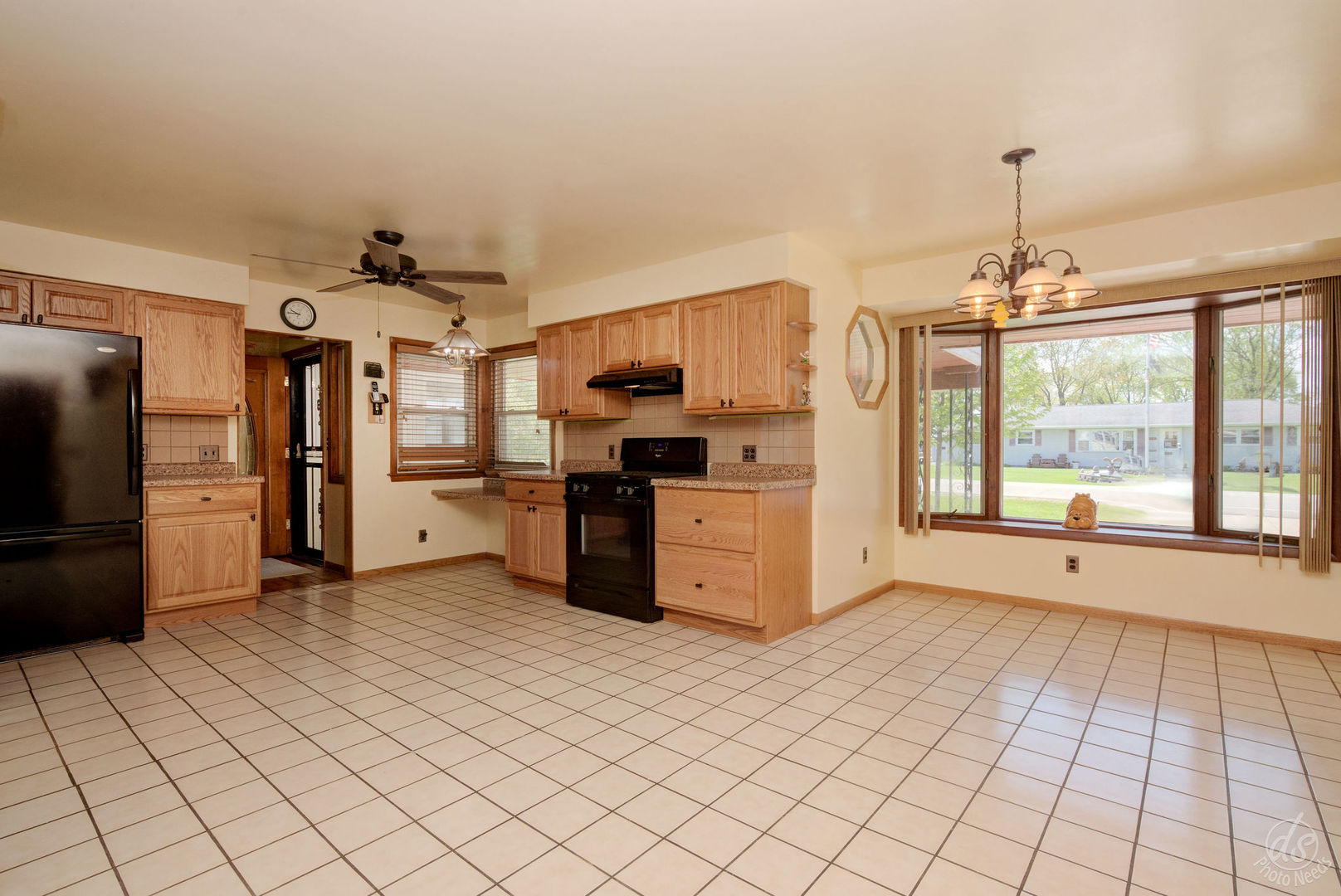 185 Swanson Road Sycamore, IL 60178 - Photo 13 of 47 a kitchen with stainless steel appliances kitchen island granite countertop a refrigerator and a sink