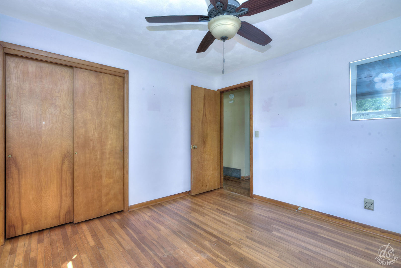185 Swanson Road Sycamore, IL 60178 - Photo 19 of 47 wooden floor in an empty room with a chandelier fan