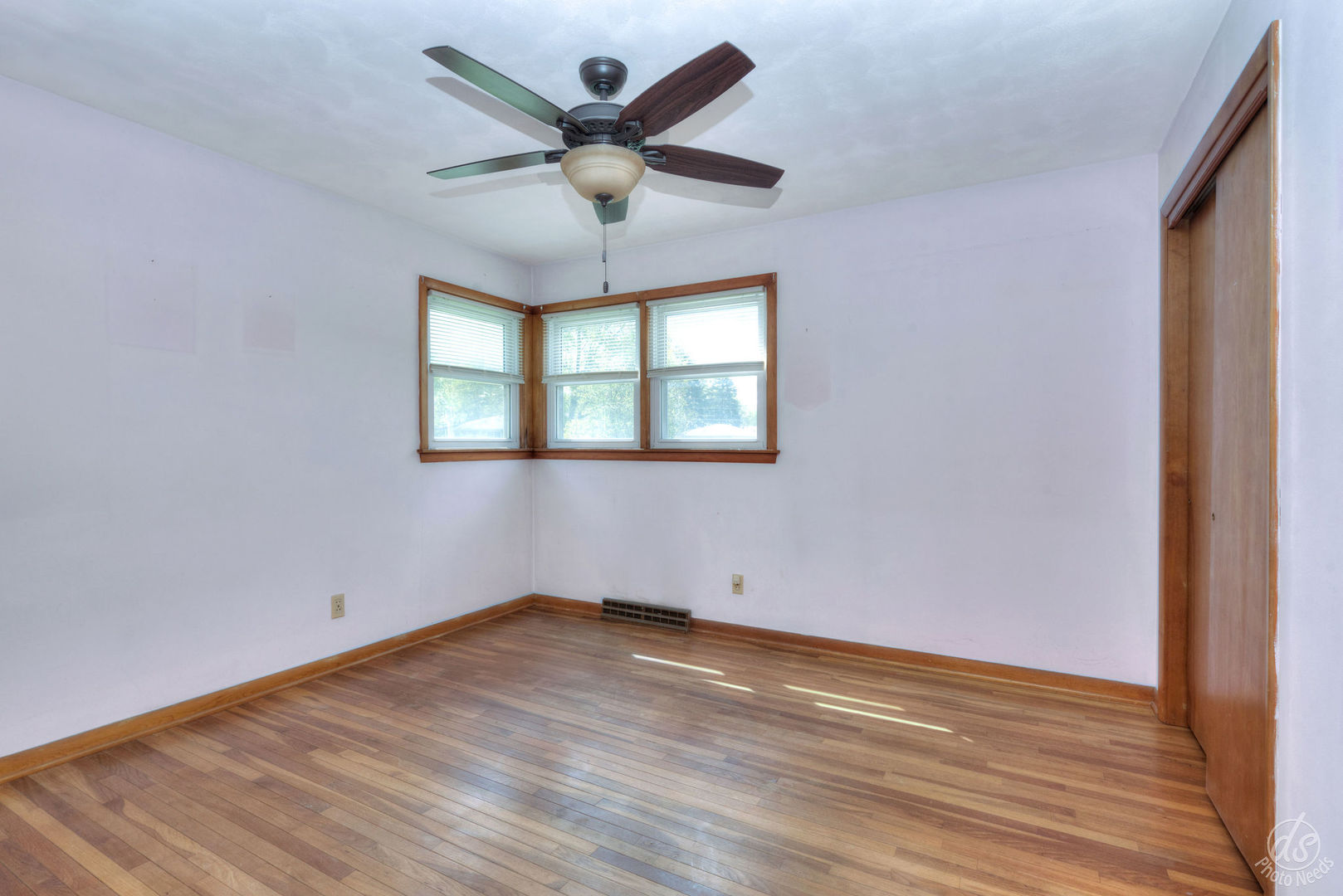 185 Swanson Road Sycamore, IL 60178 - Photo 20 of 47 an empty room with wooden floor and windows