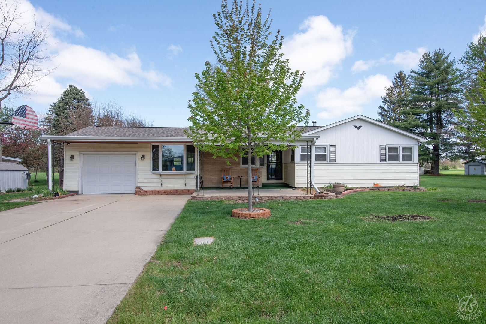 185 Swanson Road Sycamore, IL 60178 - Photo 2 of 47 a front view of a house with a garden and porch
