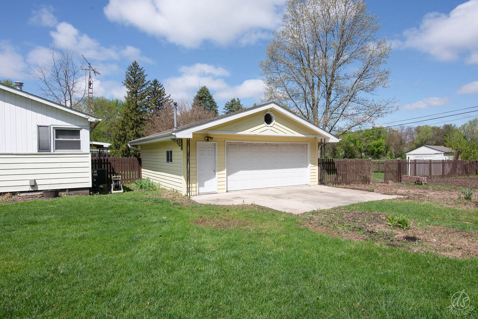 185 Swanson Road Sycamore, IL 60178 - Photo 34 of 47 a front view of a house with a yard and garage