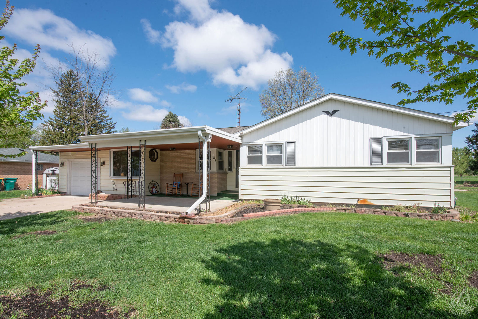 185 Swanson Road Sycamore, IL 60178 - Photo 4 of 47 a front view of house with yard and seating area