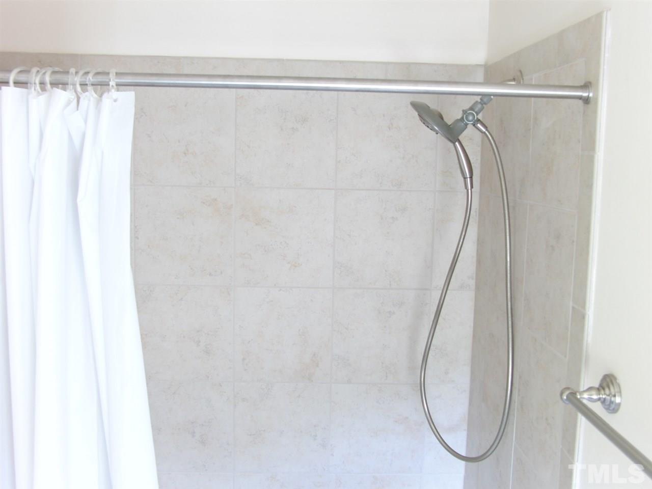 7893 Allscott Way Raleigh, NC 27612 - Photo 20 of 25 a close view of shower tap