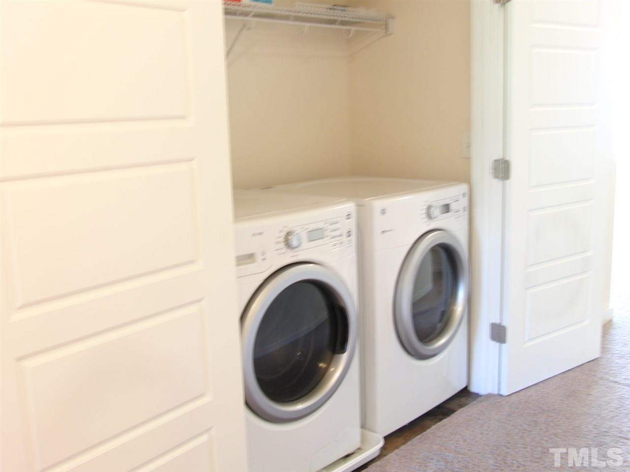 7893 Allscott Way Raleigh, NC 27612 - Photo 22 of 25 a utility room with dryer and washer