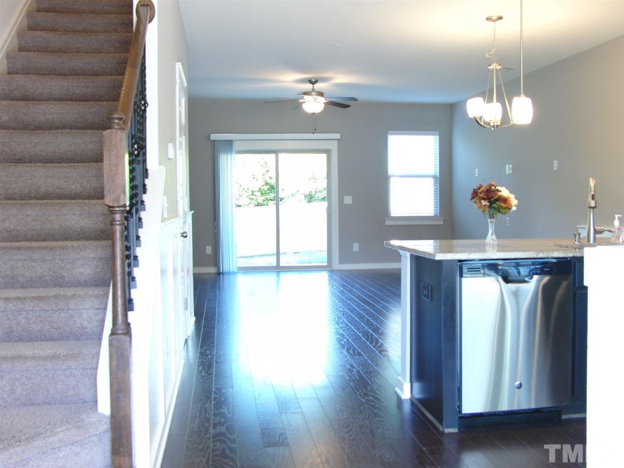 7893 Allscott Way Raleigh, NC 27612 - Photo 4 of 25 a view of entryway with wooden floor