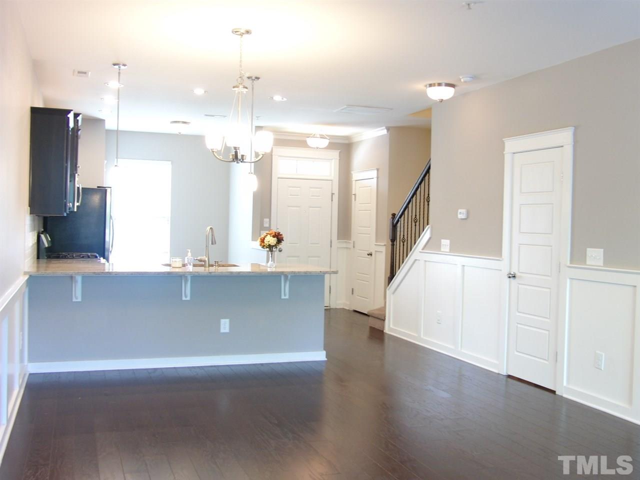 7893 Allscott Way Raleigh, NC 27612 - Photo 9 of 25 a view of a livingroom with a staircase