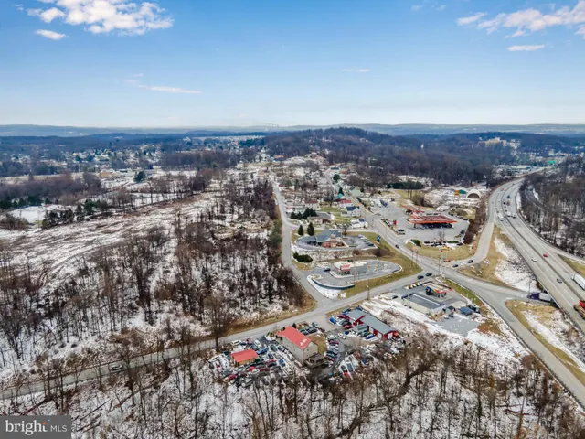an aerial view of residential house and green space
