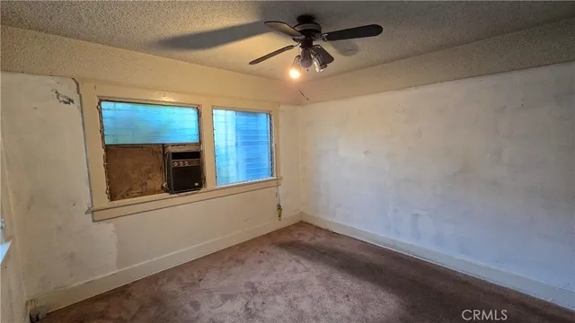a kitchen with a stove sink and cabinets