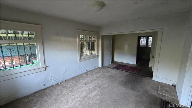 an empty room with windows