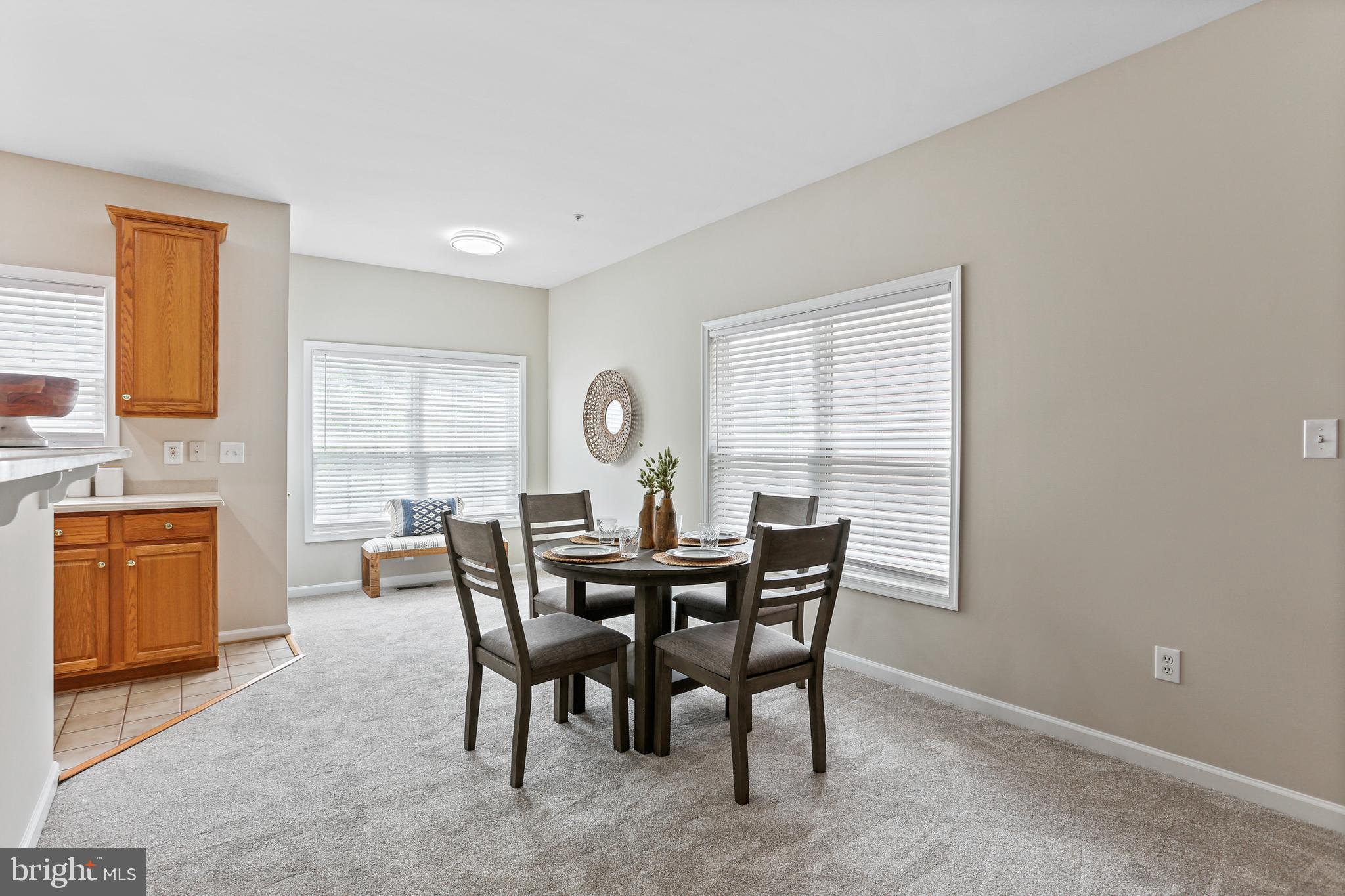 10232 Rutland Round Road, Unit 24 Columbia, MD 21044 - Photo 7 of 31 a view of a dining room with furniture and a window