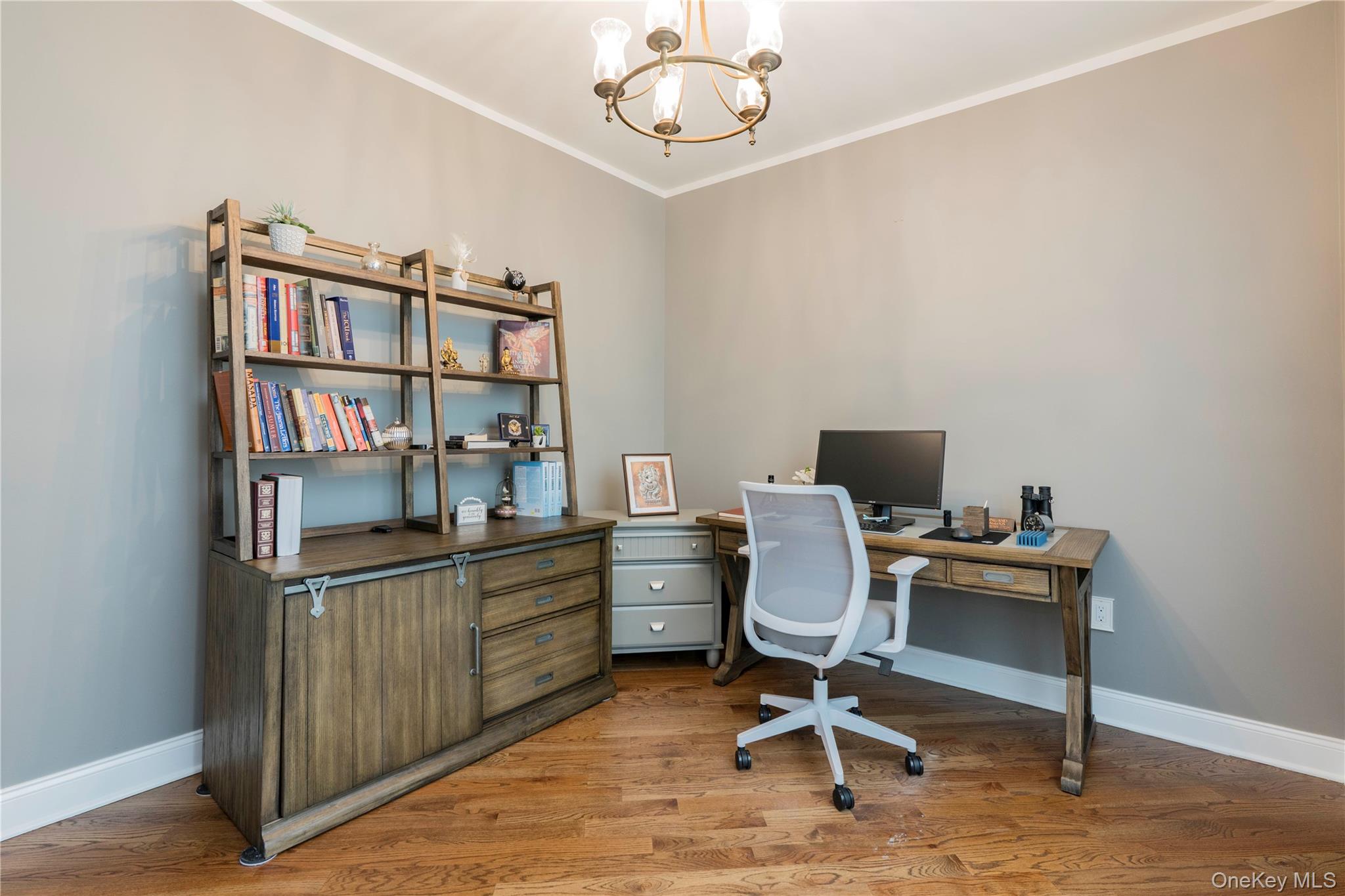 78 Moore Road Hopewell Junction, NY 12533 - Photo 21 of 38 Home office featuring crown molding, a chandelier, and light wood-style flooring