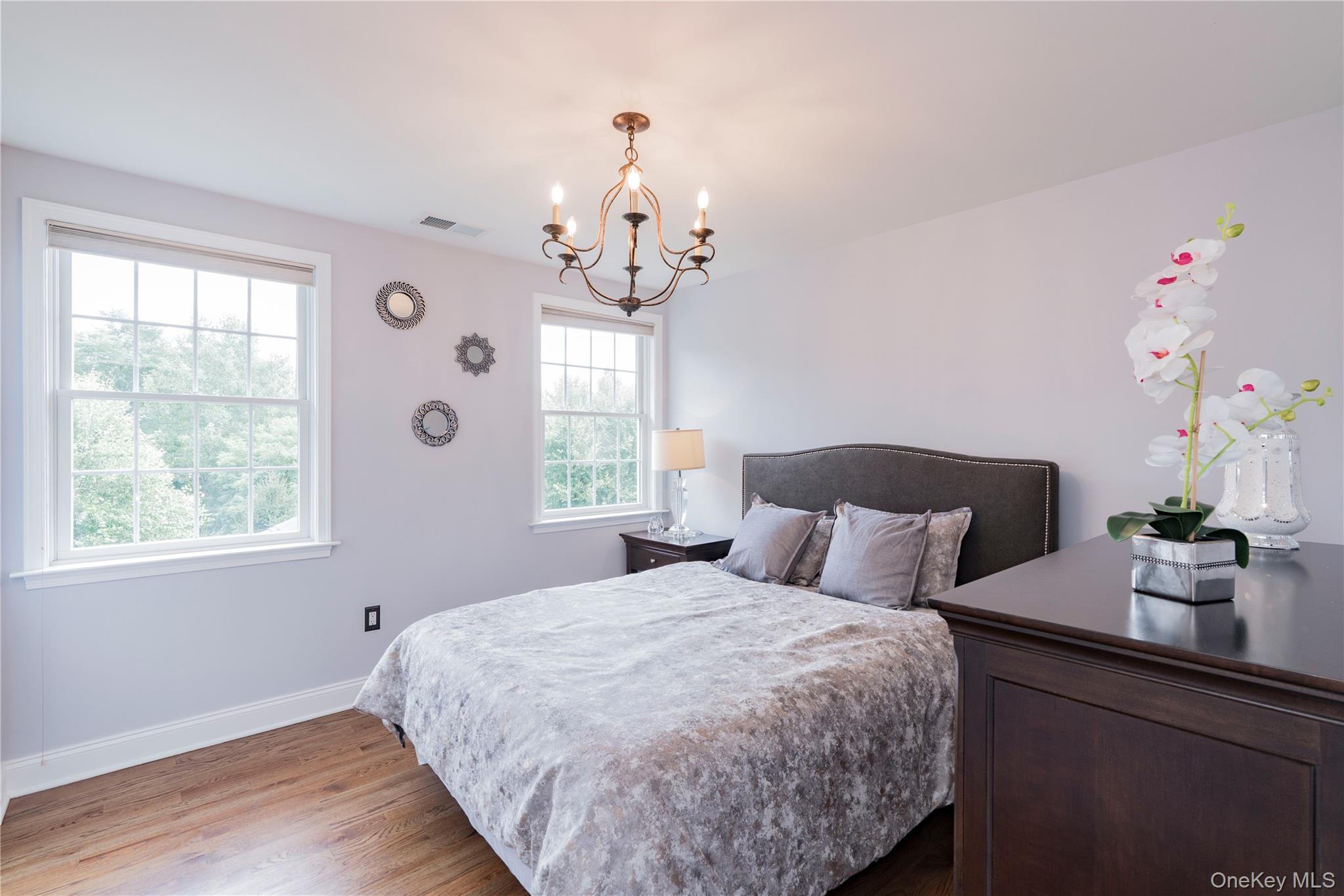 78 Moore Road Hopewell Junction, NY 12533 - Photo 28 of 38 Bedroom with wood finished floors and a chandelier
