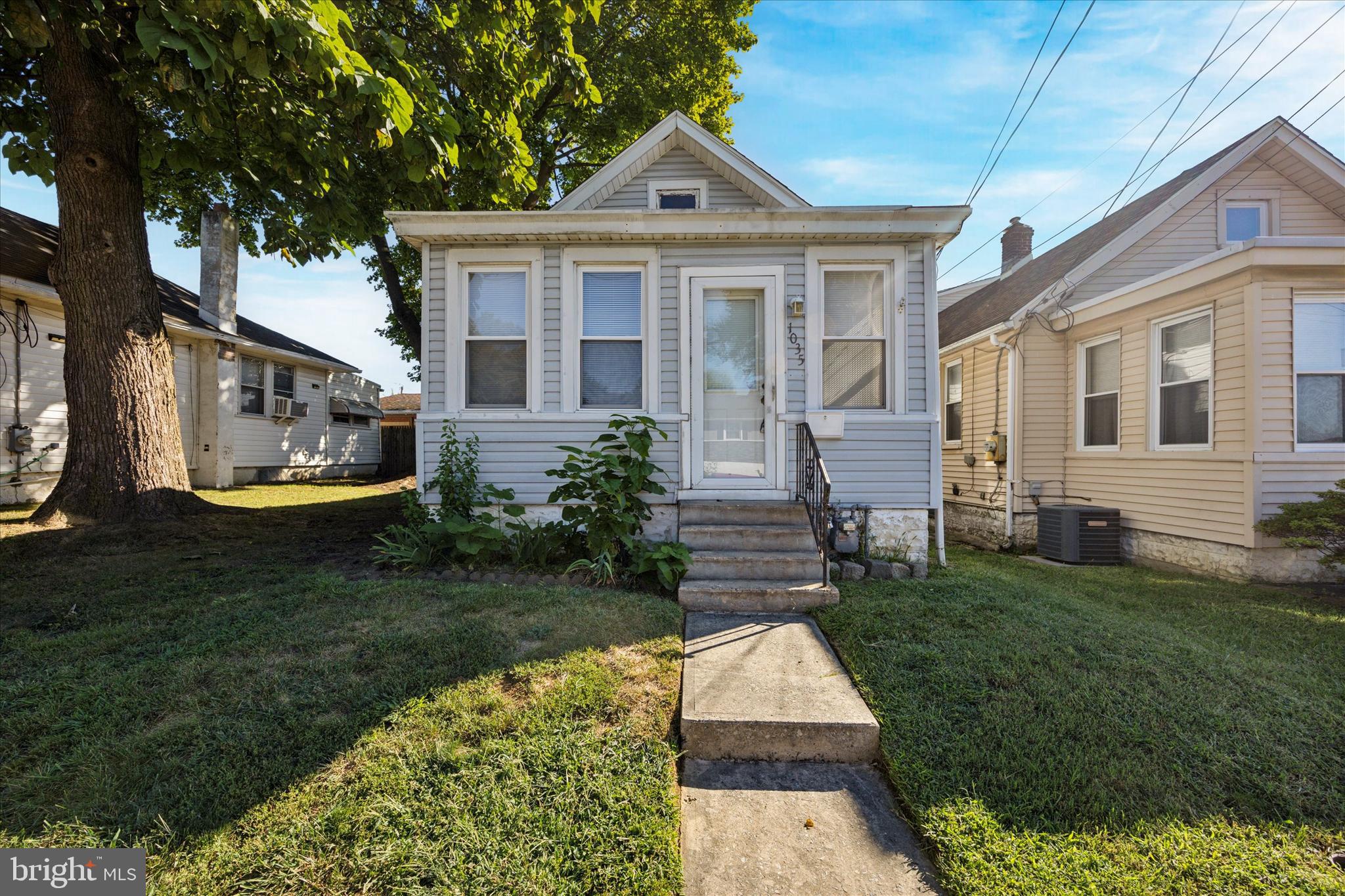 1035 Langley Street Trainer, PA 19061 - Photo 1 of 16 a front view of a house with a yard