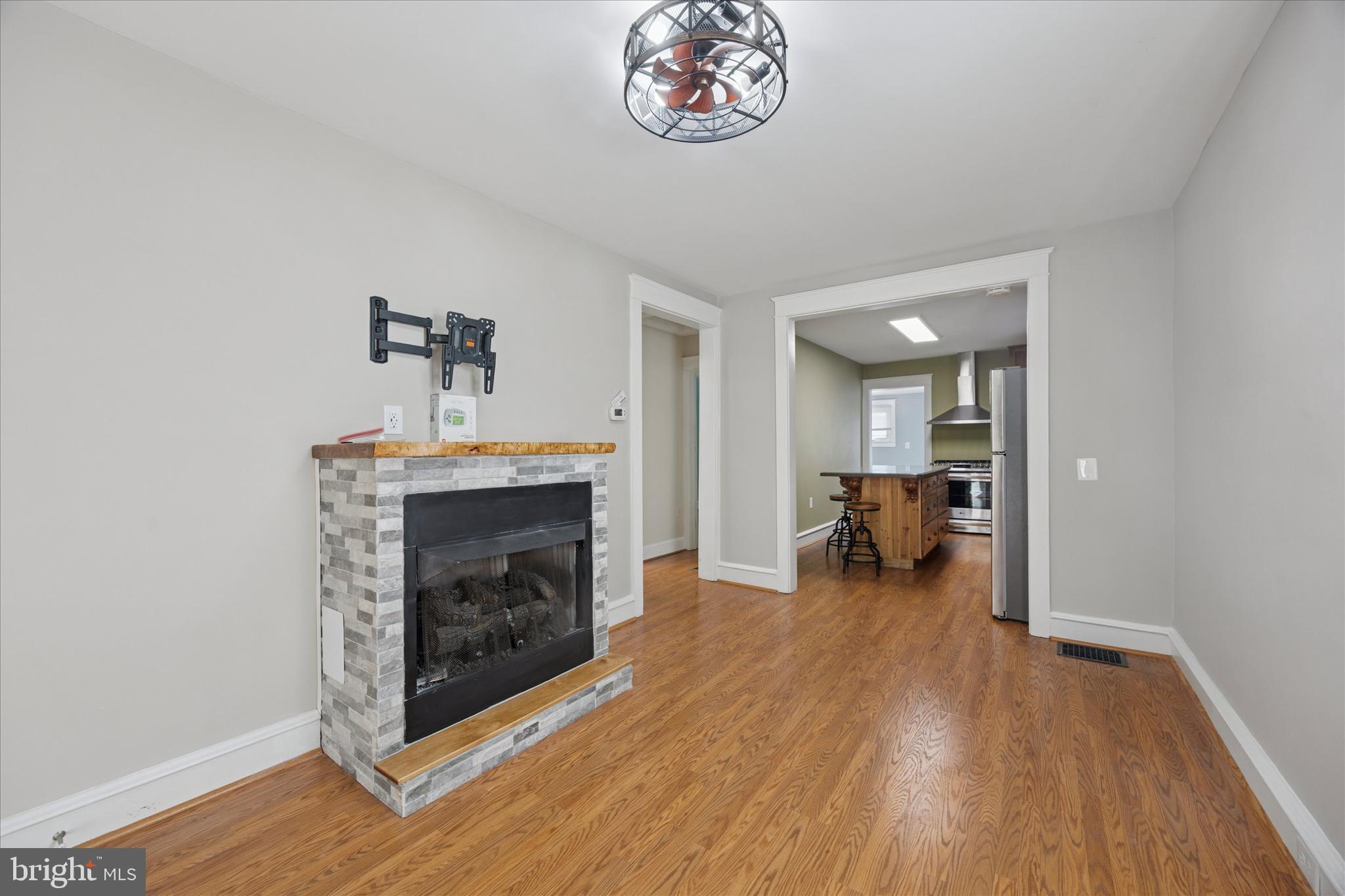 1035 Langley Street Trainer, PA 19061 - Photo 4 of 16 a living room with furniture and a fireplace