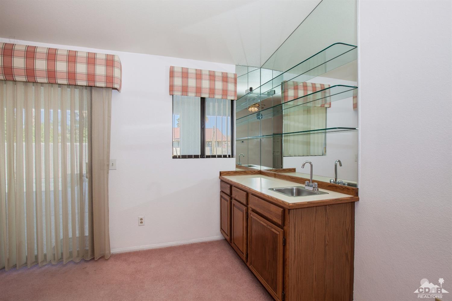 68640 Los Gatos Road Cathedral City, CA 92234 - Photo 14 of 33 a utility room with washer and dryer