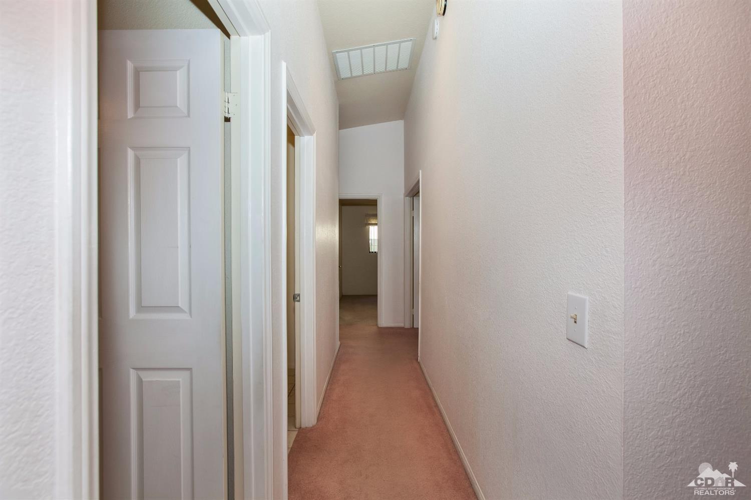 68640 Los Gatos Road Cathedral City, CA 92234 - Photo 17 of 33 a view of a hallway with closet