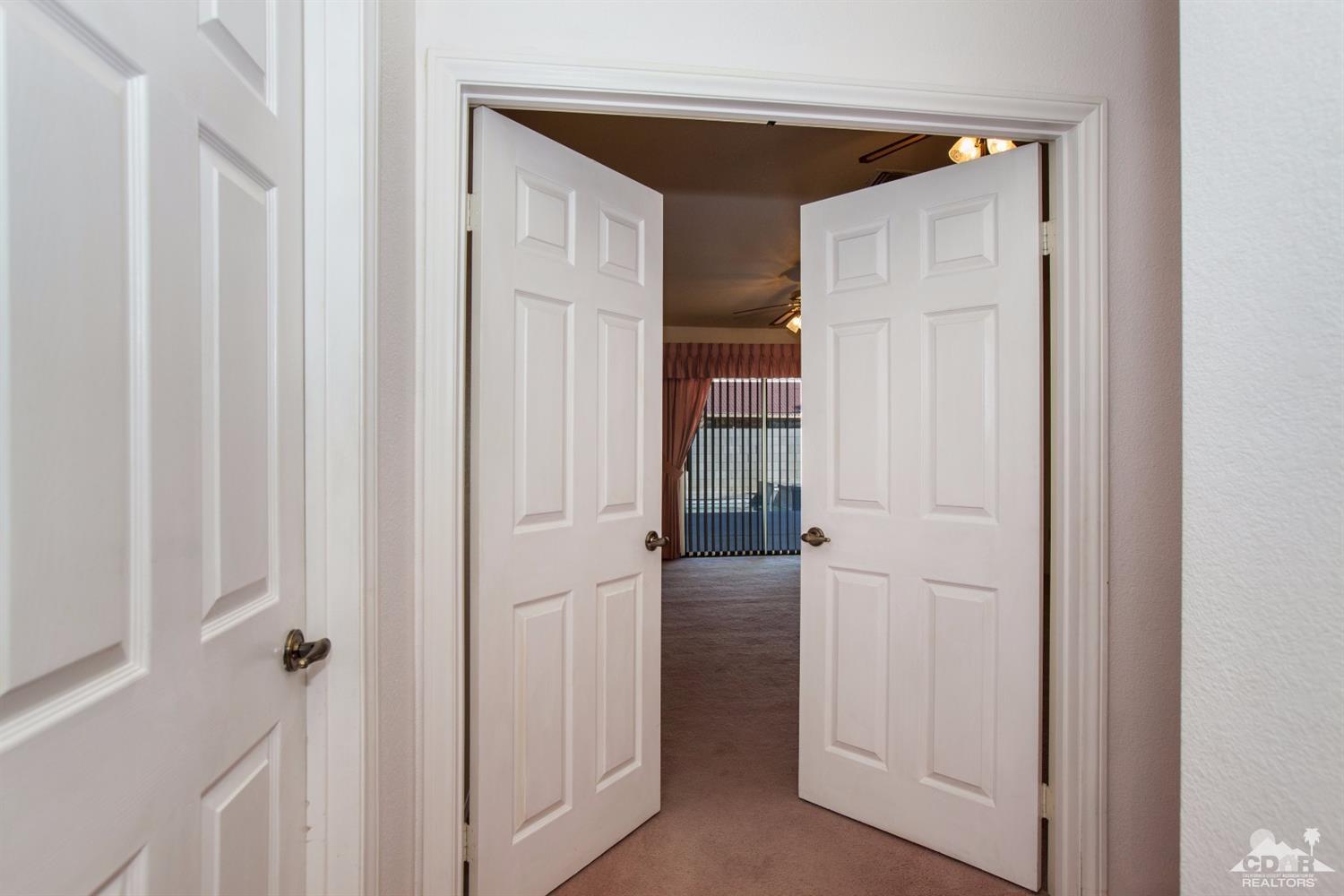 68640 Los Gatos Road Cathedral City, CA 92234 - Photo 18 of 33 a view of a hallway with closet area