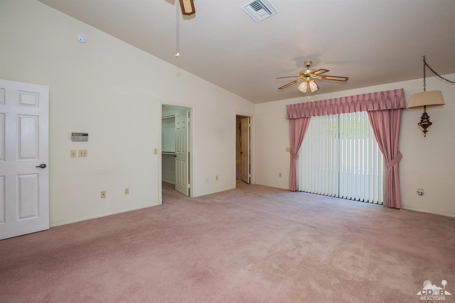 68640 Los Gatos Road Cathedral City, CA 92234 - Photo 20 of 33 a view of empty room with ceiling fan