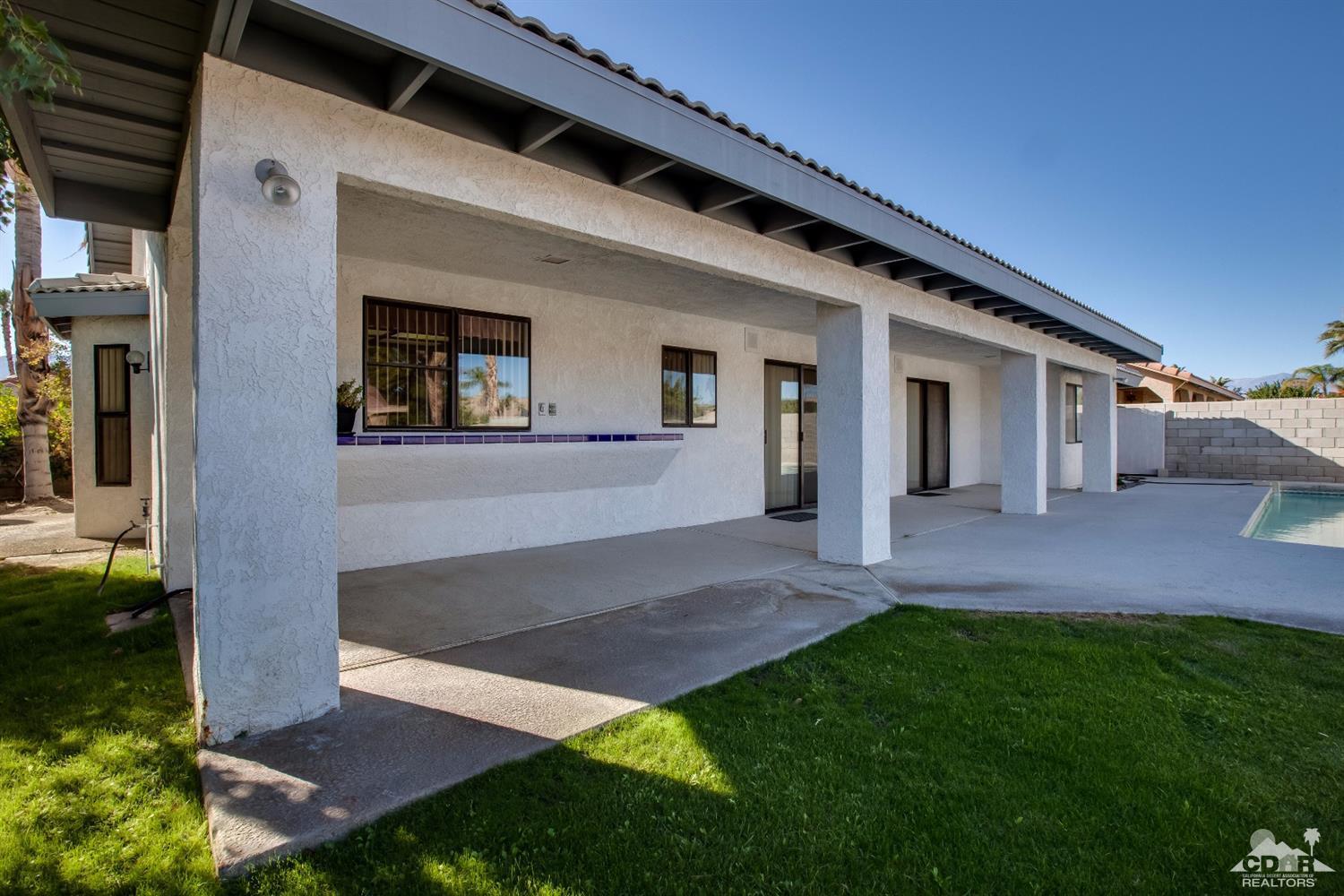 68640 Los Gatos Road Cathedral City, CA 92234 - Photo 32 of 33 a view of an house with backyard porch and entertaining space