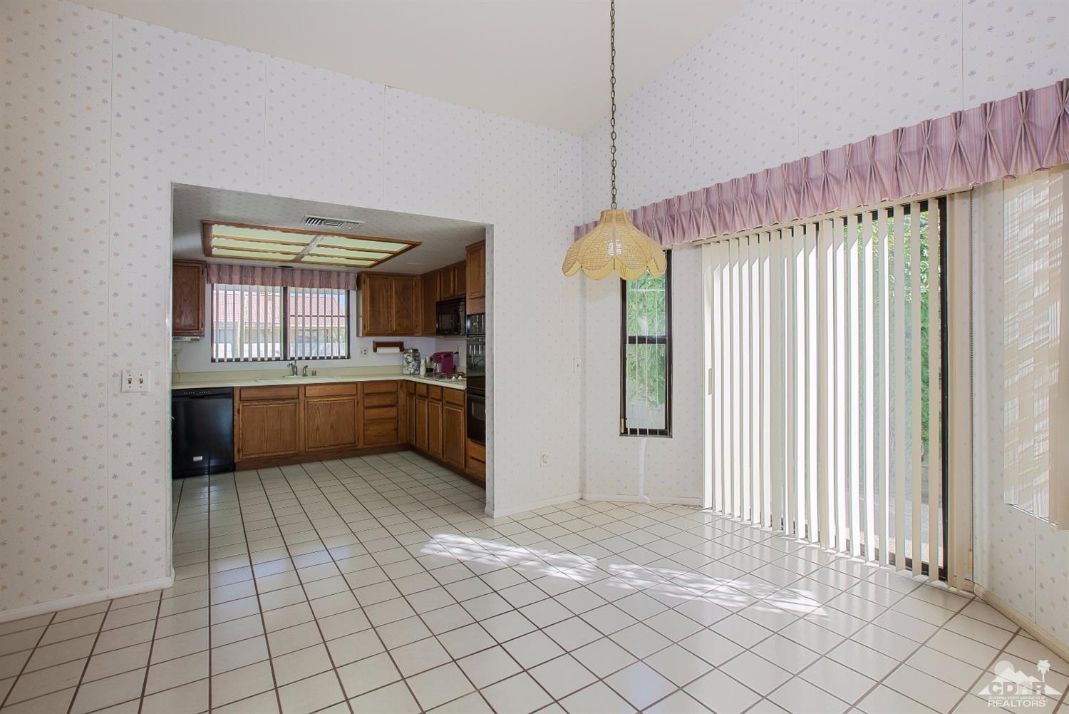 68640 Los Gatos Road Cathedral City, CA 92234 - Photo 8 of 33 a view of a kitchen with a sink and windows