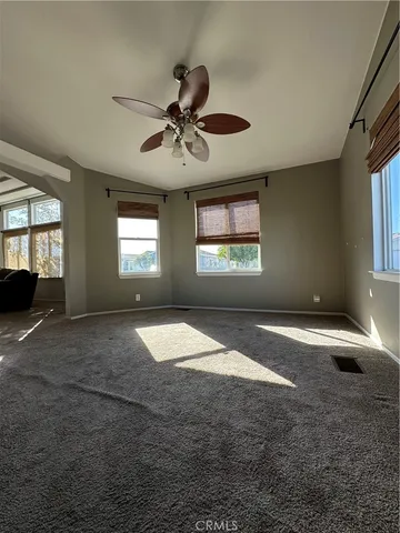 a view of empty room with windows