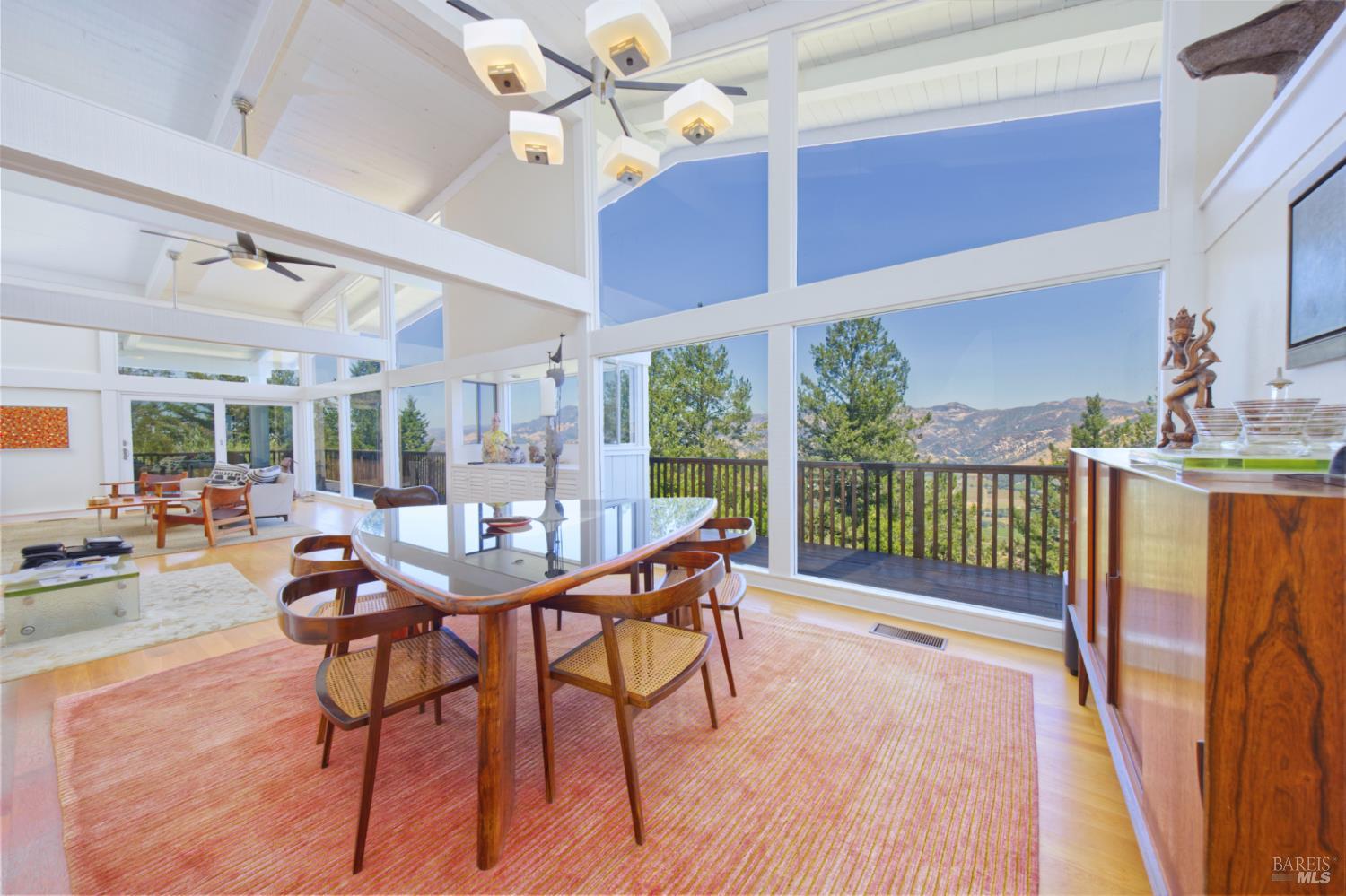 1755 Diamond Mountain Road Calistoga, CA 94515 - Photo 15 of 67 a dining room with furniture and a floor to ceiling window