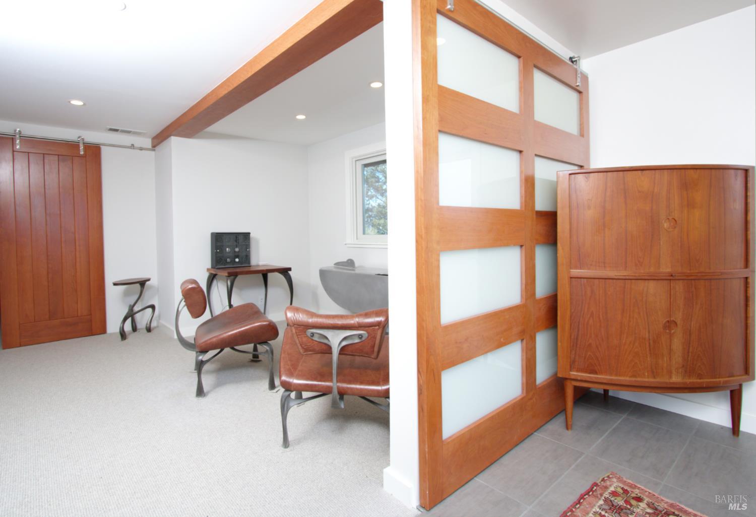 1755 Diamond Mountain Road Calistoga, CA 94515 - Photo 21 of 67 a bedroom with furniture and a window