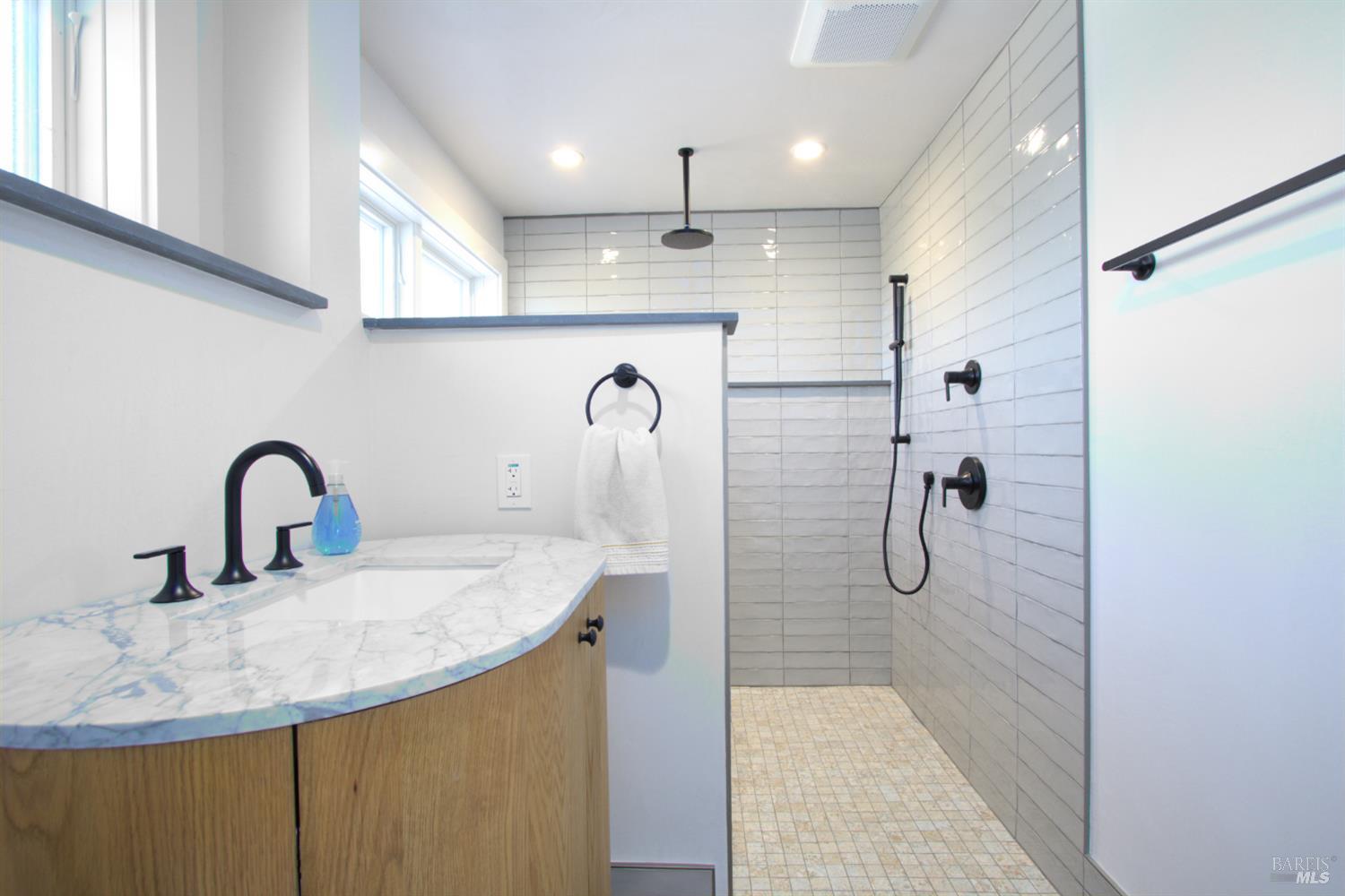 1755 Diamond Mountain Road Calistoga, CA 94515 - Photo 22 of 67 a bathroom with a sink and mirror