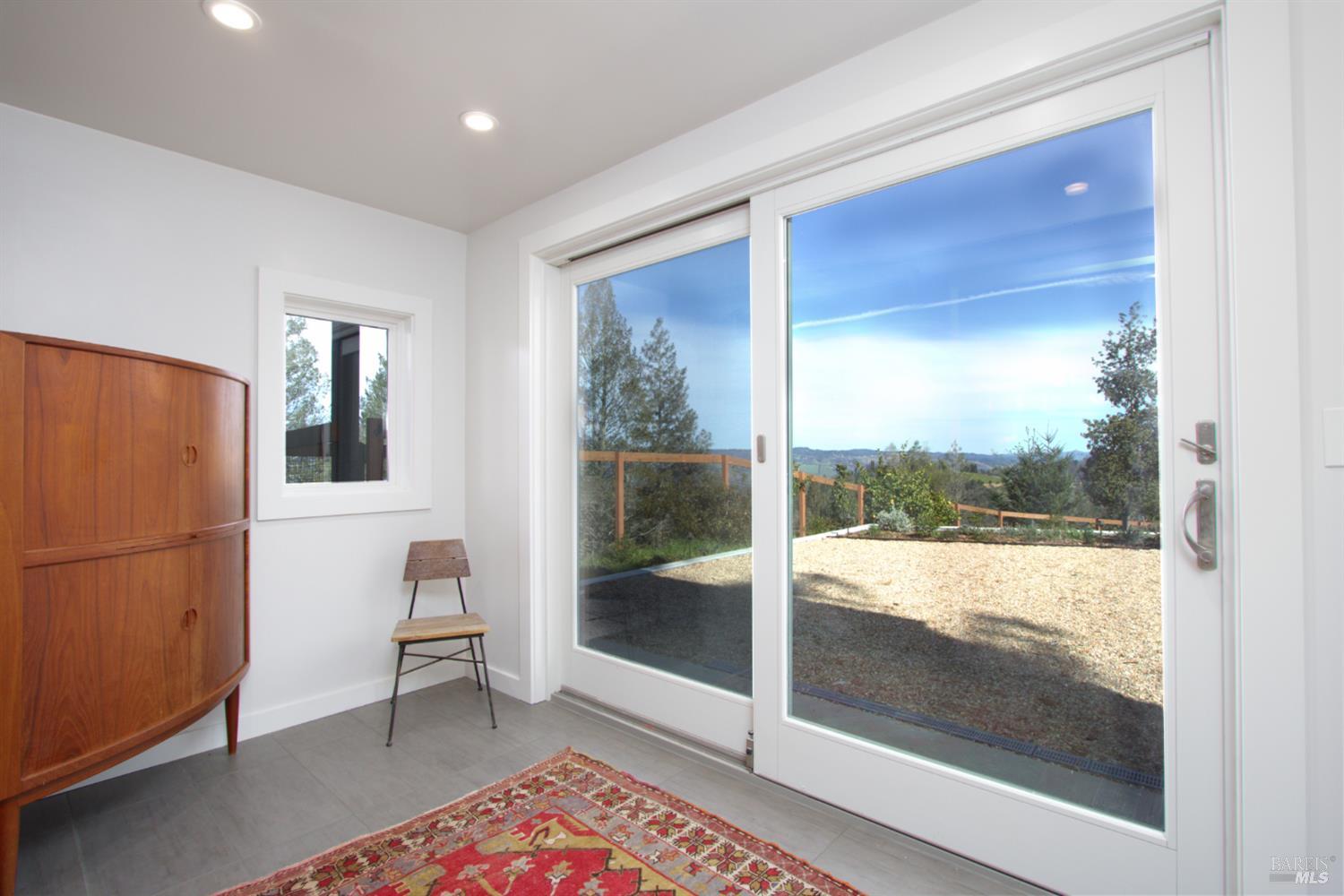 1755 Diamond Mountain Road Calistoga, CA 94515 - Photo 23 of 67 a view of a room that has a bed window and wooden floor