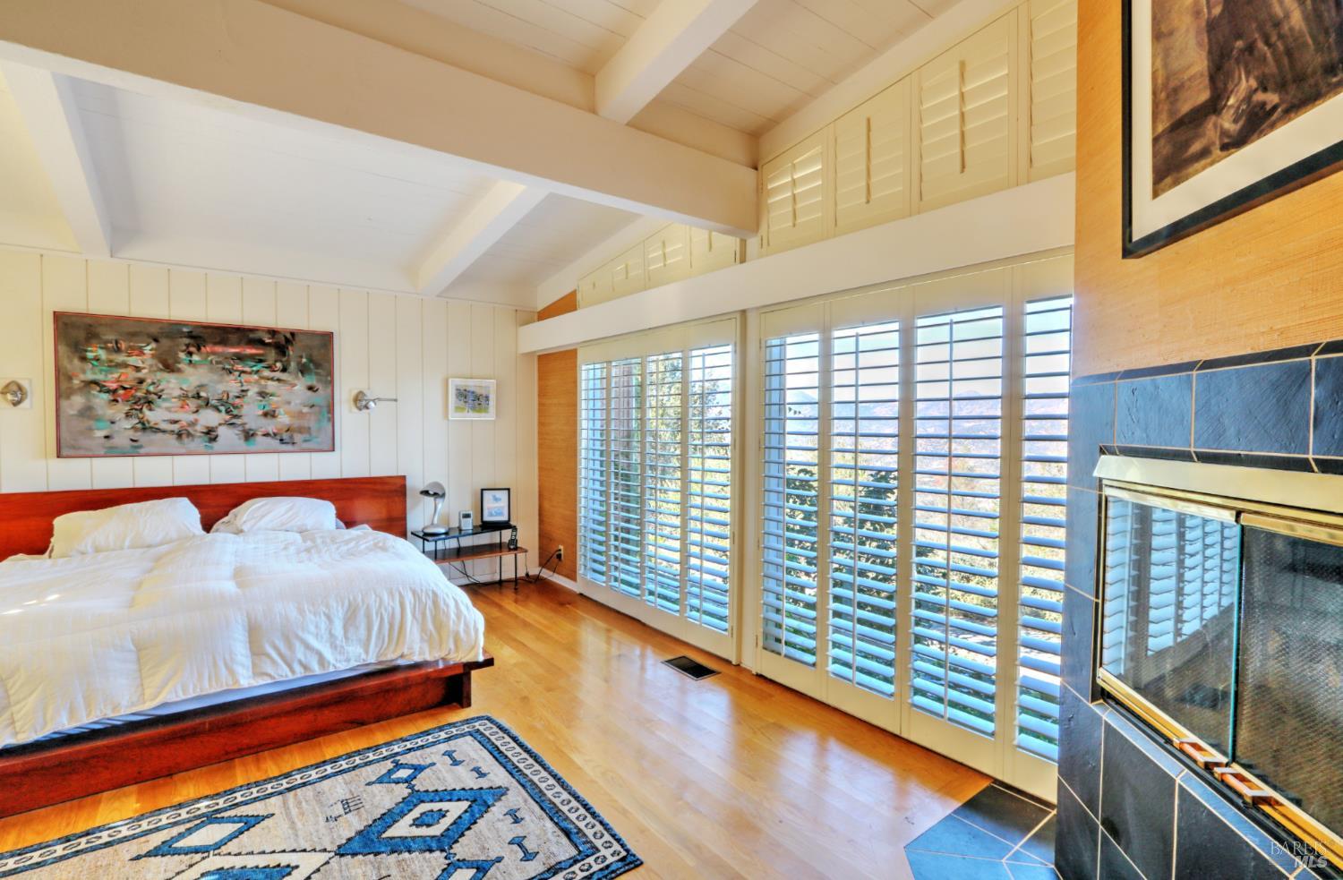 1755 Diamond Mountain Road Calistoga, CA 94515 - Photo 25 of 67 a bed room with a bed and a large window