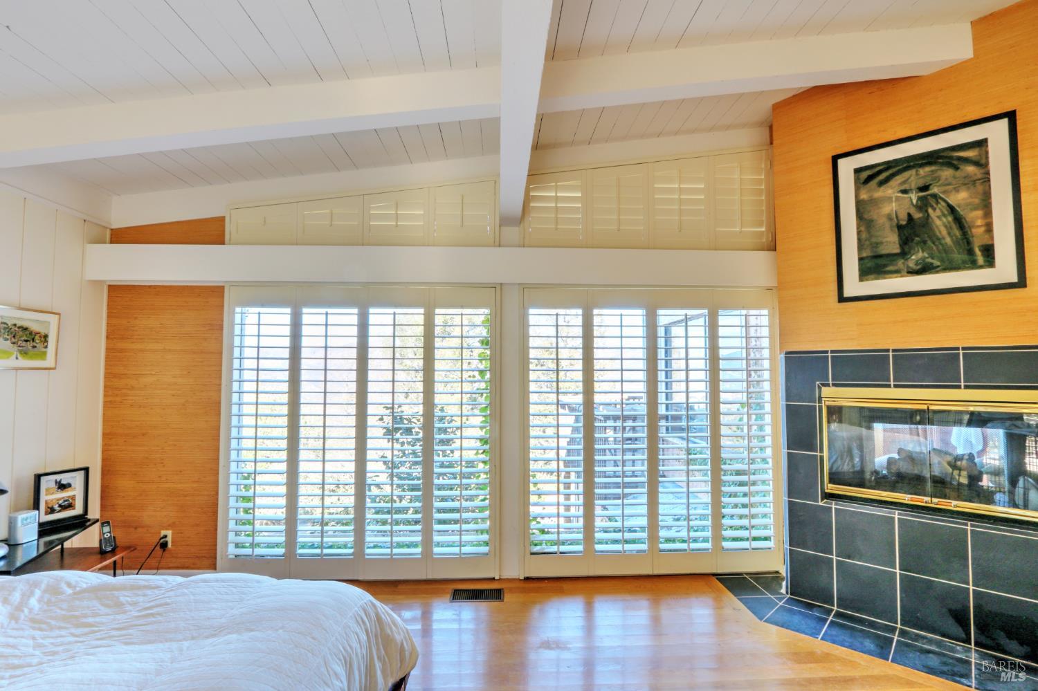1755 Diamond Mountain Road Calistoga, CA 94515 - Photo 26 of 67 a view of a bedroom with furniture and windows