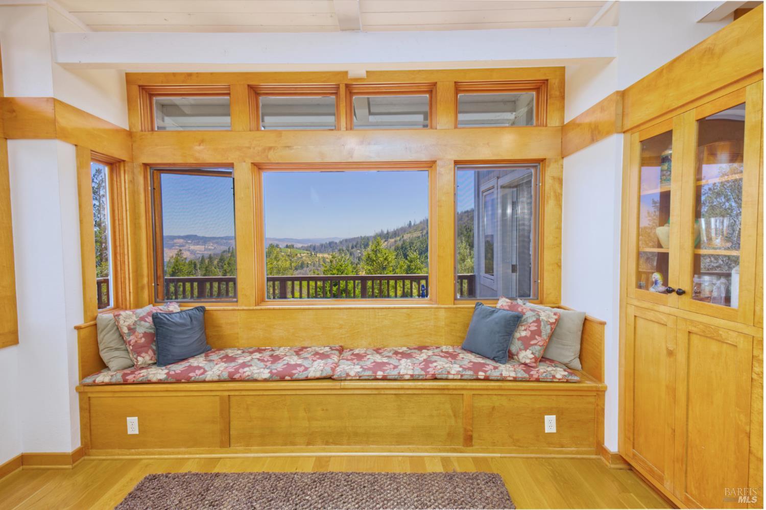 1755 Diamond Mountain Road Calistoga, CA 94515 - Photo 29 of 67 a living room with large windows