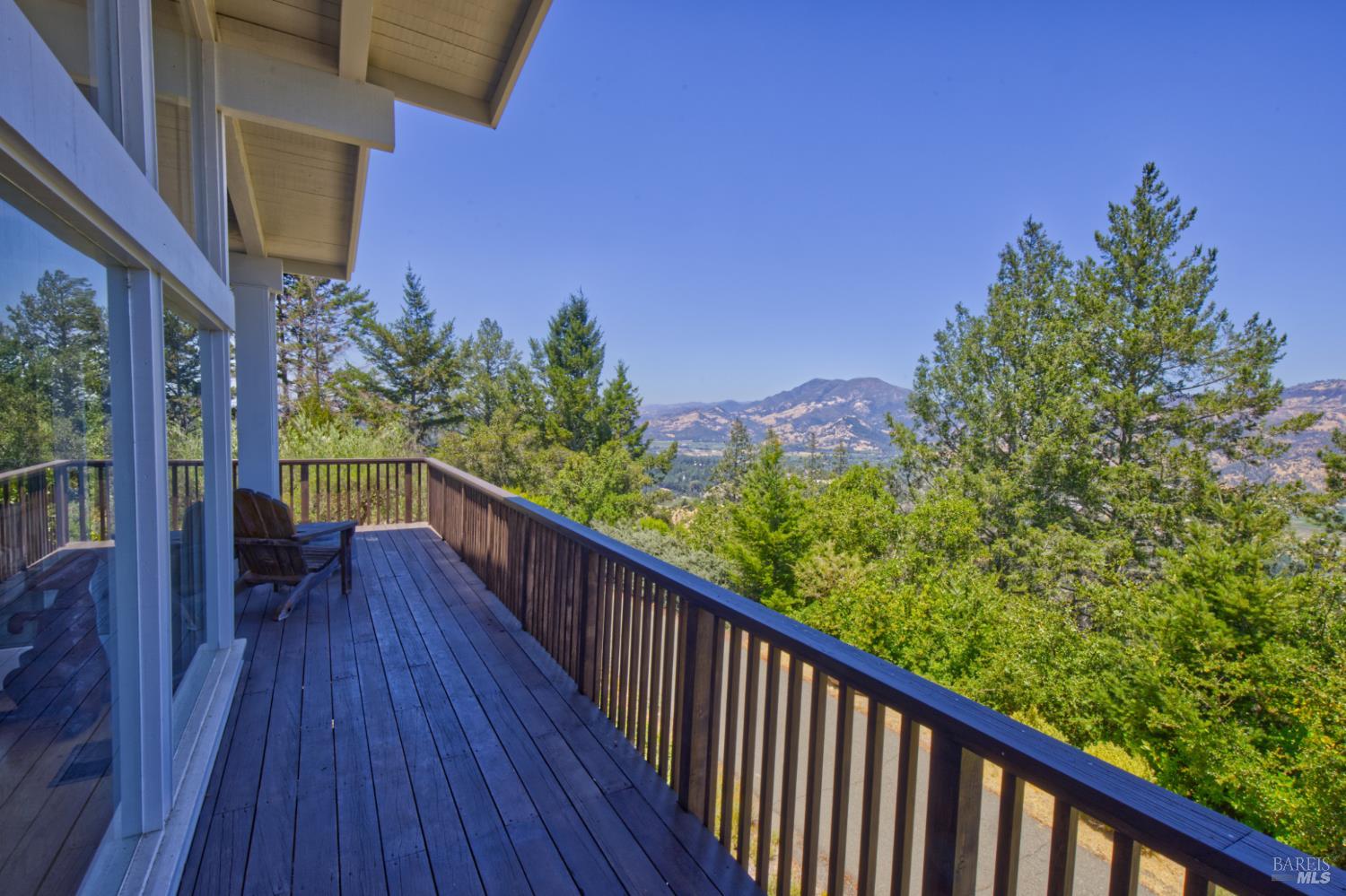 1755 Diamond Mountain Road Calistoga, CA 94515 - Photo 33 of 67 a view of a balcony with wooden floor and fence